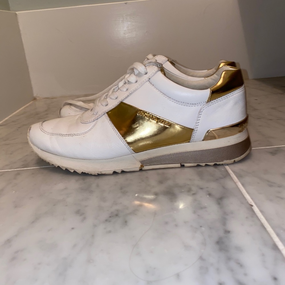 Micheal Kors gold and white sneakers